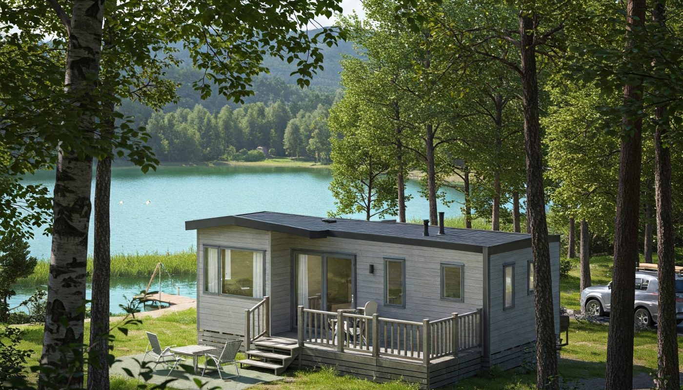 Mobil-home moderne blanc, design aérodynamique, grandes fenêtres, camping verdoyant avec lac clair, ambiance paisible.